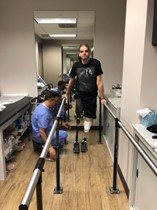 Gabey Abikzer during rehabilitation after losing both legs
