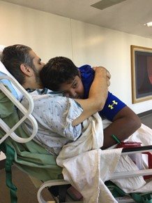 Gabey Abikzer in the period following the accident in which he lost both legs