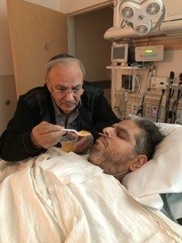 Gabey Abikzer in the period following the accident in which he lost both legs