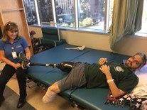 Gabey Abikzer during rehabilitation after losing both legs